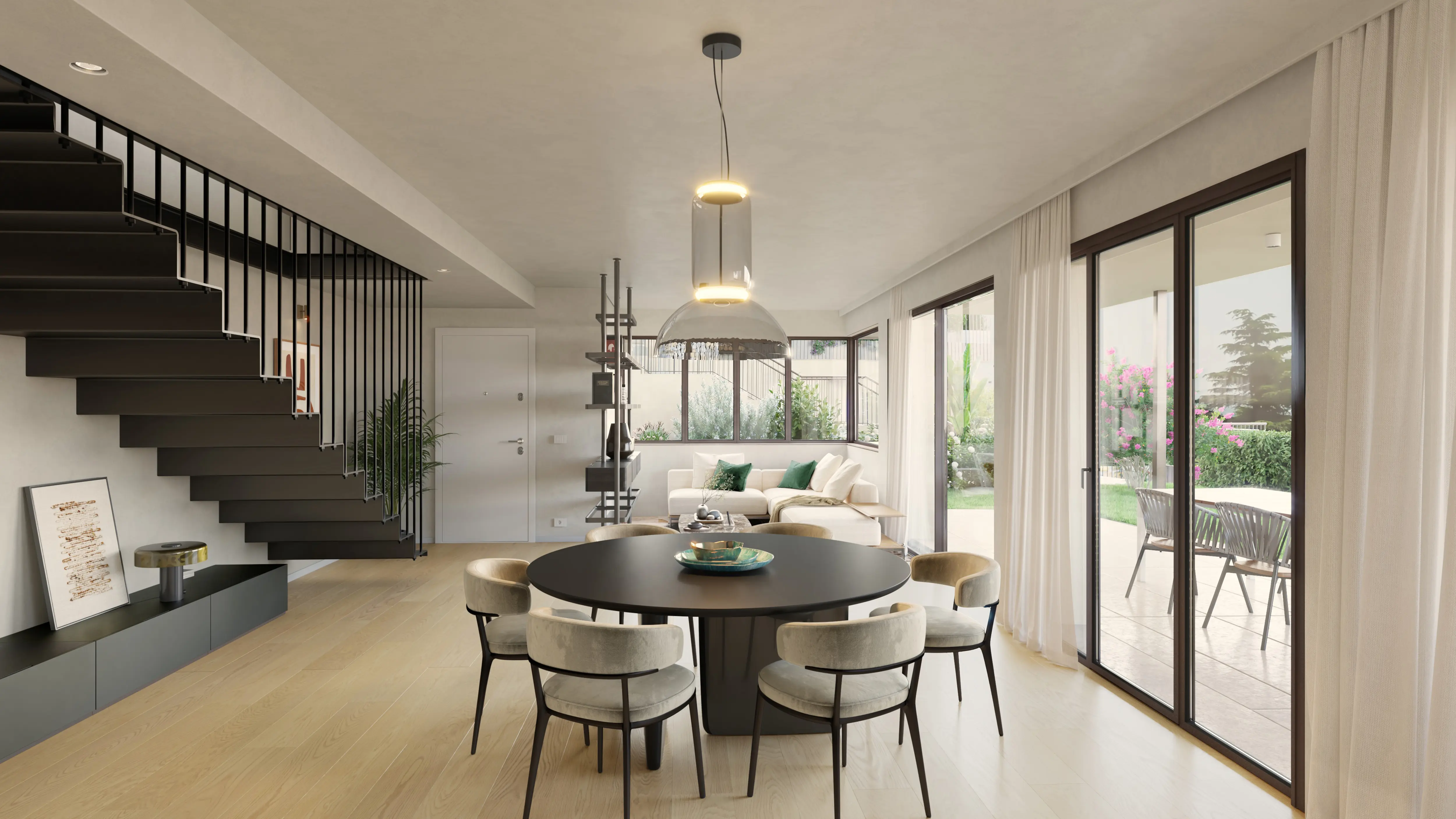 Modern open living room with a round black dining table surrounded by six beige chairs, beige sofa with green cushions, large windows, and a black metal staircase.
